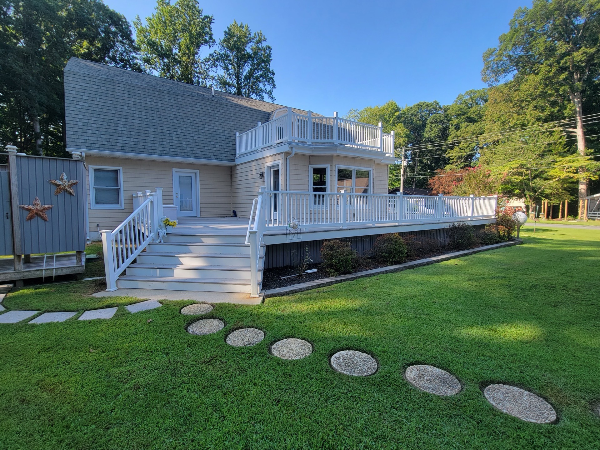Beautiful landscaped property with stepping stone pathway