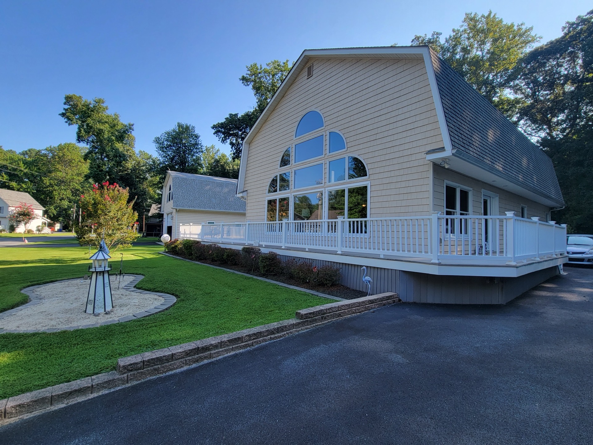 Professional landscape design with retaining wall and curved driveway