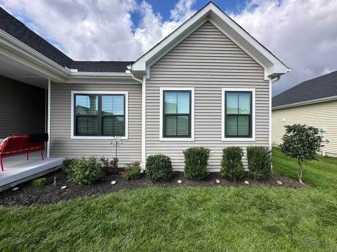 Neatly trimmed shrubs and clean beds after maintenance